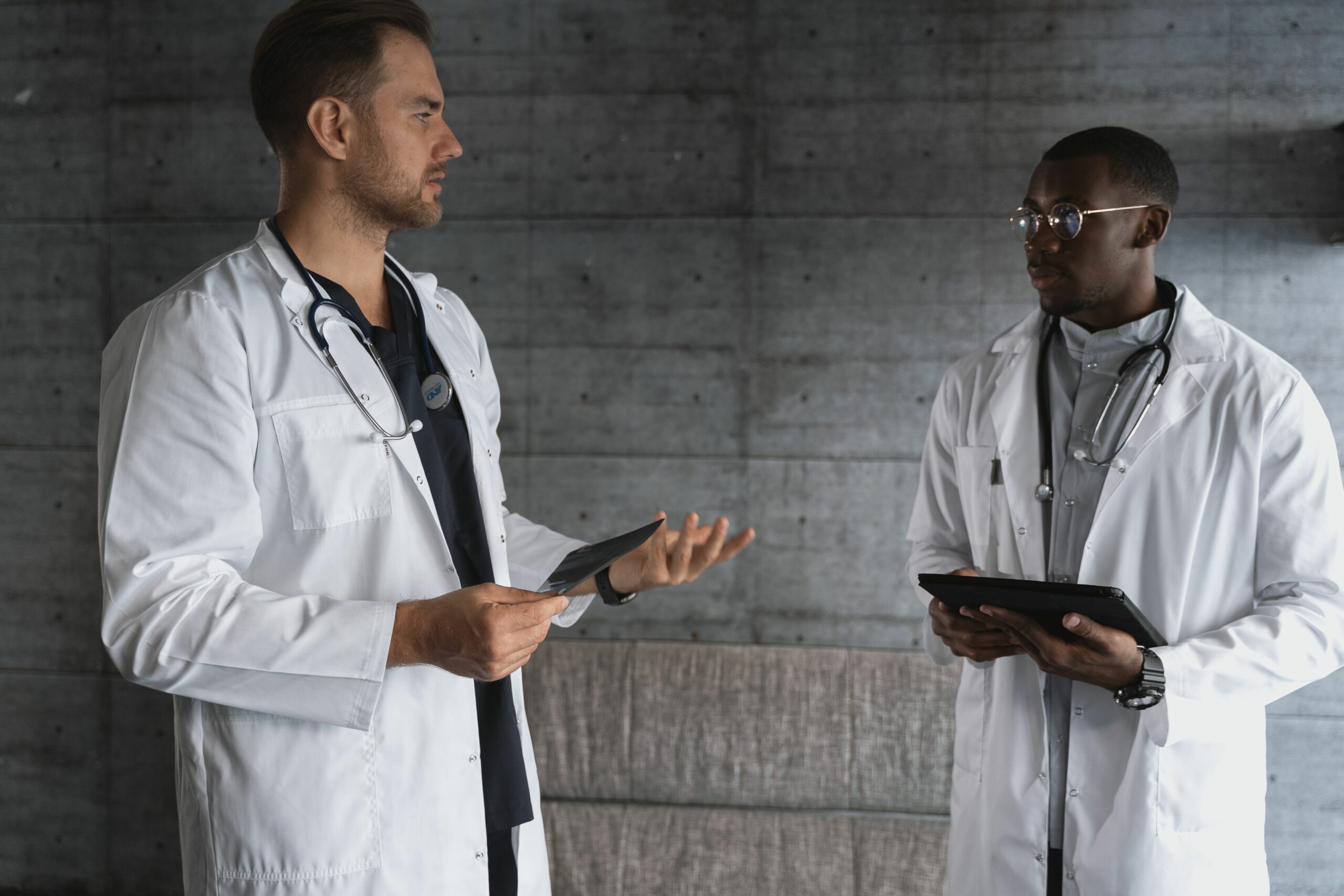 Two healthcare professionals of different backgrounds in discussion